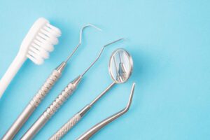 Dental tools on a blue background.