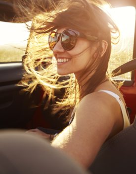 Smiling girl in a jeep with temporomandibular joint dysfunction