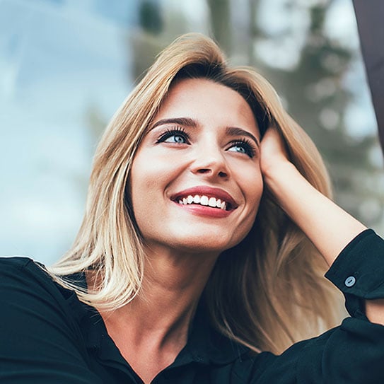 A smiling woman with straight white teeth.