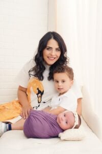 Lewisville dentist Dr. Amria poses for a photo with her children